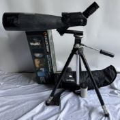 A Celestron Ultima 100ED spotting scope on a tripod with box and cover