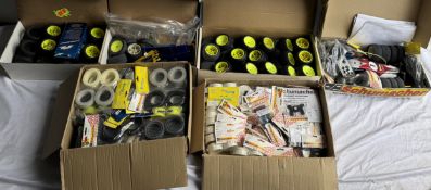 Two Radio controlled model cars in parts together with two boxes of wheels and other accessories