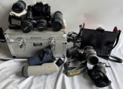A Koma TS-501 Scope together with a Minolta X-700 35mm camera, lenses,