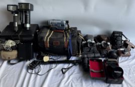 A Minolta XD7 35mm camera together with a Sony Digital * video camera,