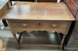An 18th century oak lowboy,