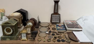 A black slate mantle clock together with an onyx mantle clock,