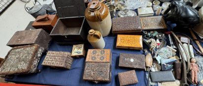 A collection of carved and inlaid jewellery boxes together with stoneware bottles, fishing reels,