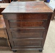 An 18th century and later oak coffer of square form with a planked top,