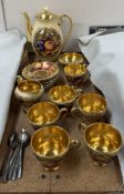 An Aynsley Orchard gold part coffee set some pieces bear a signature for N Brunt,