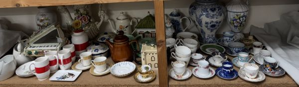 A Royal Stuart part tea service together with coffee cans and saucers,