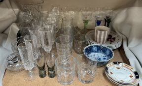 A glass decanter together with drinking glasses,