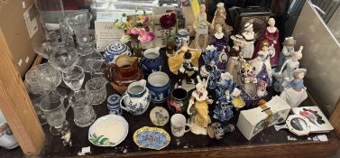 A Moorcroft pottery vase painted with flowers together with pottery figures of ladies,