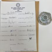 A glass paperweight dated 1976 together with Sri Lanka cricket team signed autograph sheet 1990