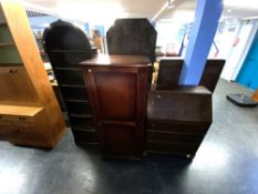 Bookcase, cabinet and a bureau