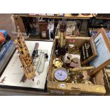 A box of brass maritime items, a folding anchor, bells, a Titanic whistle, a Tiffany style