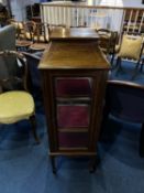 A narrow Edwardian mahogany display cabinet