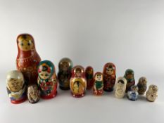 A selection of Russian nesting dolls of varying styles and designs, the largest H 34cm including