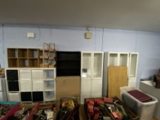 Various Ikea display units, a trestle table and two boxed New Ikea desks