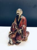 Early oriental stoneware figure A.F