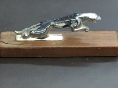 Jaguar car mascot on wooden base