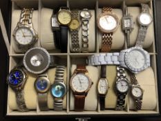 Collection of fashion watches in display case