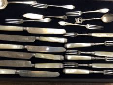 Collection of Georgian silver cake knives, forks & others with monarchs head
