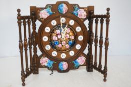 Quarts wall clock with ceramic decoration