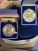 Large box of unsorted medals & tokens