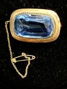 9ct Gold brooch set with large blue stone