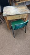 Vintage wooden school desk features a hinged lift-