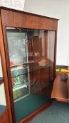 Vintage wooden and glass display cabinet with sliding doors, adjustable glass shelves, and