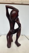 Hand-carved abstract wooden sculpture, depicting a