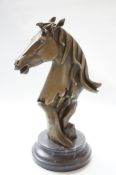 Bronze horses head on marble base
