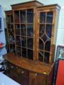 An Edwardian inlaid mahogany and walnut display cabinet, the breakfront top with three astragal
