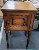 A mid 20th century walnut French style bedside cabinet on reeded, tapering legs, 74h x 41w Location: