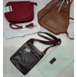 Radley- A brown leather crossover bag with blue leather dog toggle and branded dust bag together