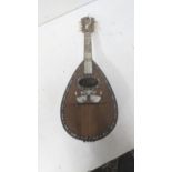 An Italian mandolin with label inscribed 'Il Globo' decorated with a mother of pearl and