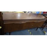 A mid 20th century retro sideboard having three drawers, a fall flap and two cupboard doors, 76h x