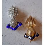 Two Royal Artillery regimental collar badges in the form of a grenade with flames, blue enamel