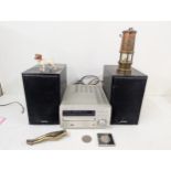 A mixed lot to include a nutcracker fashioned as a pair of legs, a miners lamp and a Denon Dab Radio