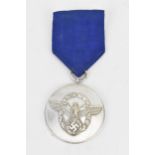 A German Third Reich police 8 year long service medal, suspended on original cornflower blue