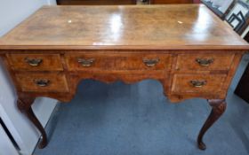 A 1920's Queen Anne style walnut writing desk. Location:A1B If there is no condition report,