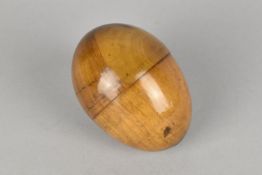 A Treen Sewing Etui Modelled as an Egg Containing Thread and Needle Case, 7cms Long