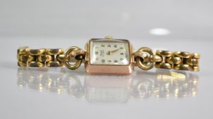 A 9ct Gold Cased Ladies Rone 15 Jewel Wrist Watch, Champagne Face with Arabic Numerals, Case