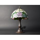 A Small Tiffany Style Table Lamp with Patinated Bronze Base, 31cms High