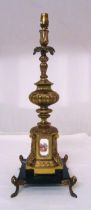 A gilt metal and porcelain table lamp on black marble base, 60cm (h)
