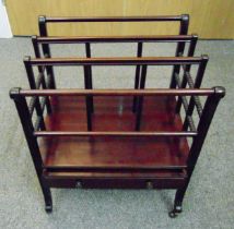 A mahogany four section rectangular Canterbury with single drawer on original brass castors, 56.5