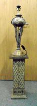 A composition lamp stand on matching rectangular plinth, 133cm (h)