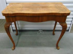 A Queen Anne style walnut shaped rectangular games table on four cabriole legs, 77x 94.5 x 48.5cm