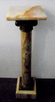 An Edwardian marble and ormolu torchere of customary form with square plinth and stepped square base
