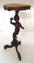 A carved mahogany figural plant stand on three outswept legs, 75cm (h)