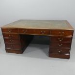 A reproduction mahogany veneered twin-pedestal partner's desk, with tooled and embossed green