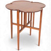 Arthur Simpson of Kendal, Arts and Crafts tray-top oak folding table, the quatrefoil top with