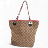 GUCCI - a canvas GG monogram Eclipse tote bag, with red leather strap, serial no. 120836/002058
